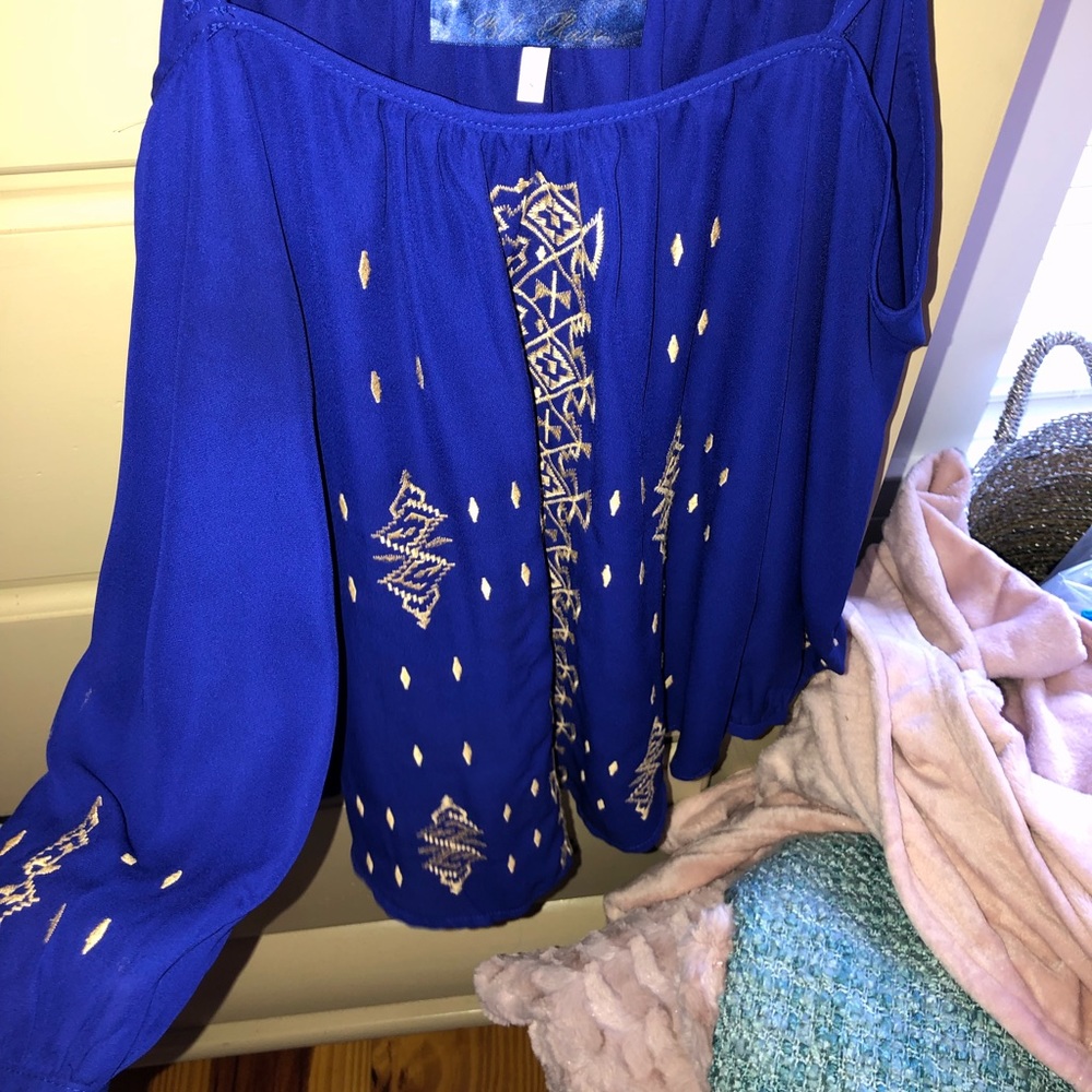 Top with straps and hangs off the shoulder